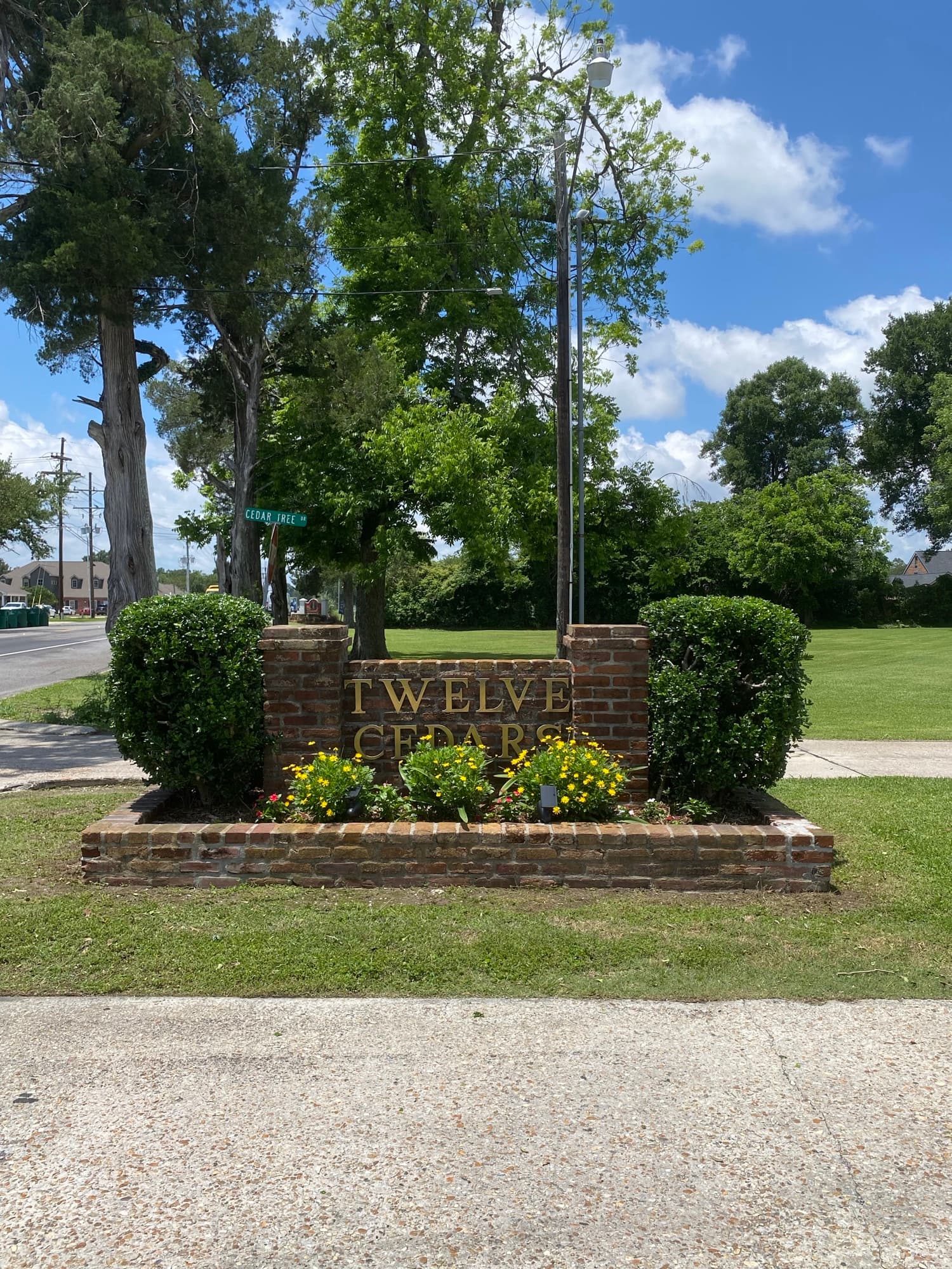 HOA subdivision entrance with manicured landscaping maintained by TIMCO in Thibodaux, LA