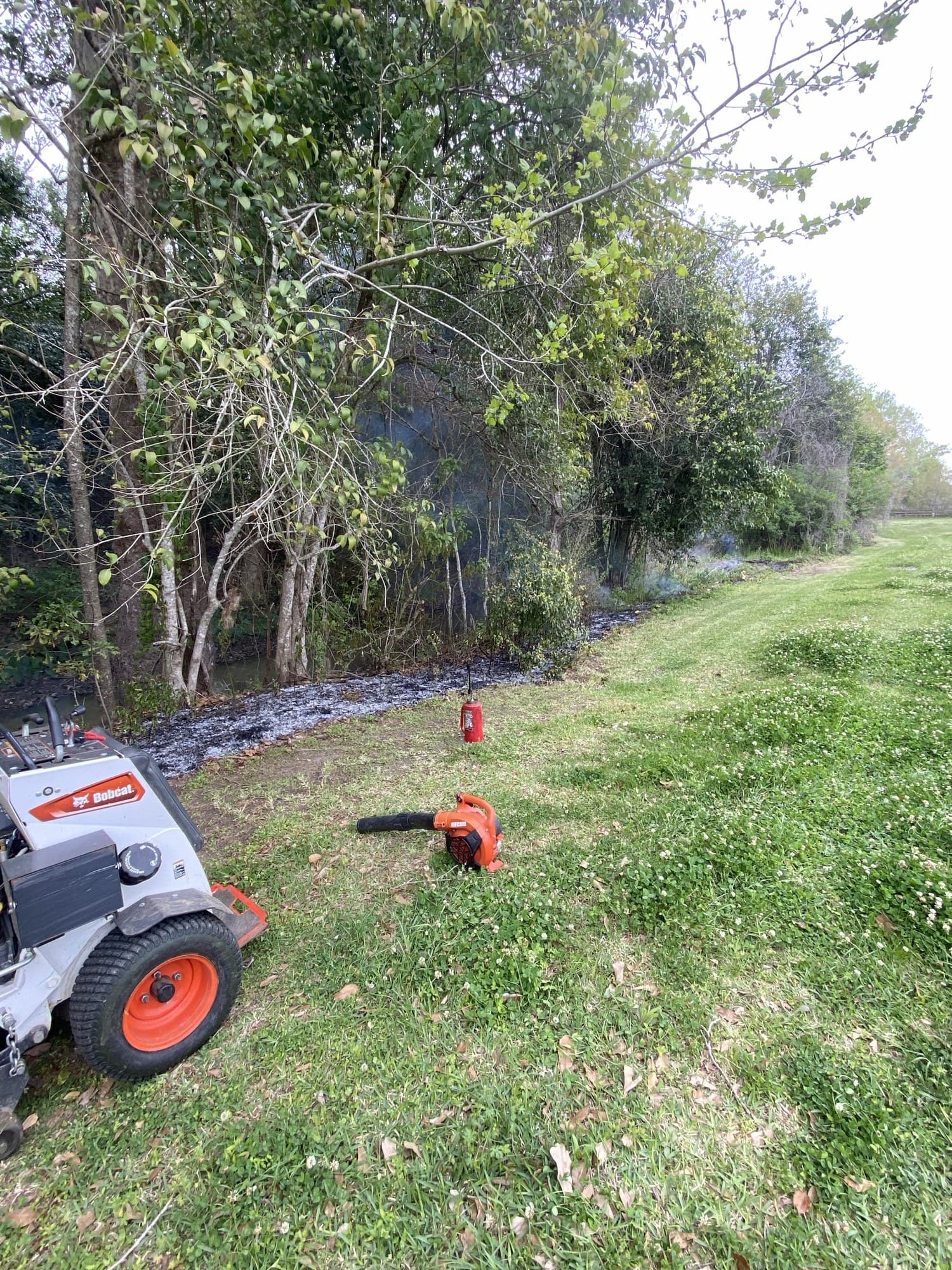 TIMCO crew clearing a ditch bank with equipment to open up drainage in the Bayou Region